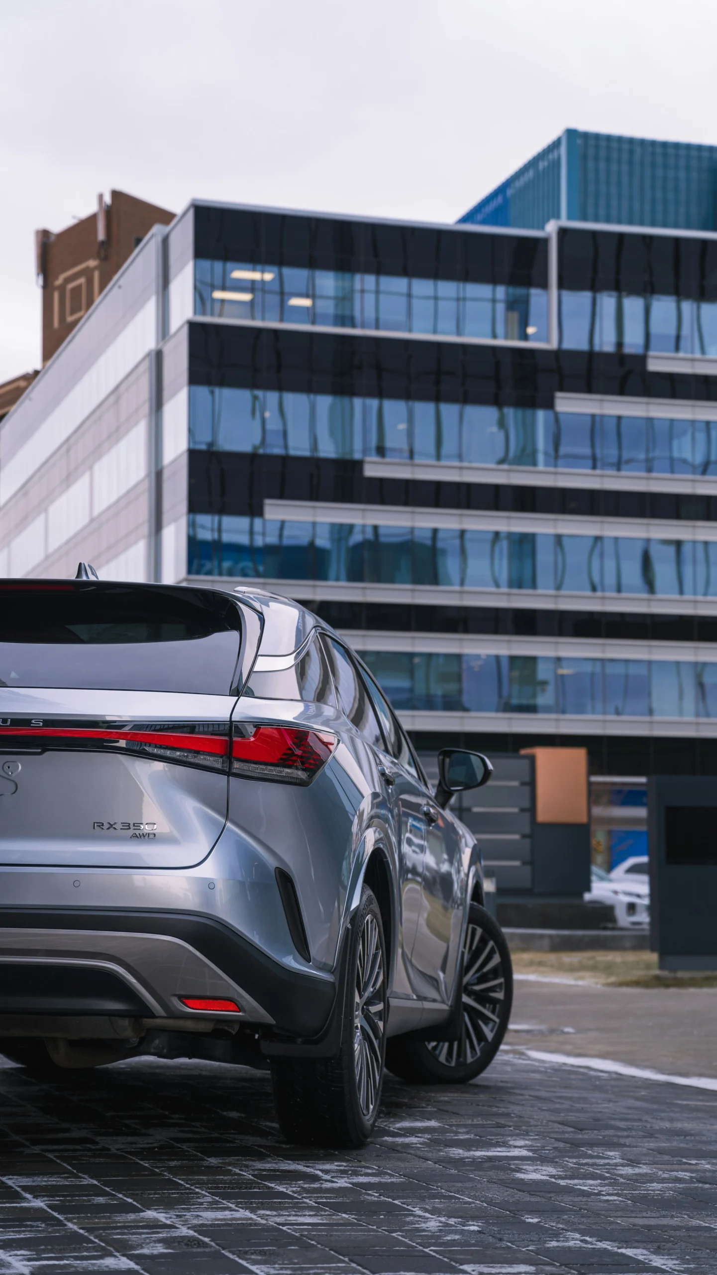 Lexus RX 350 parked in an urban setting viewed from the rear angle