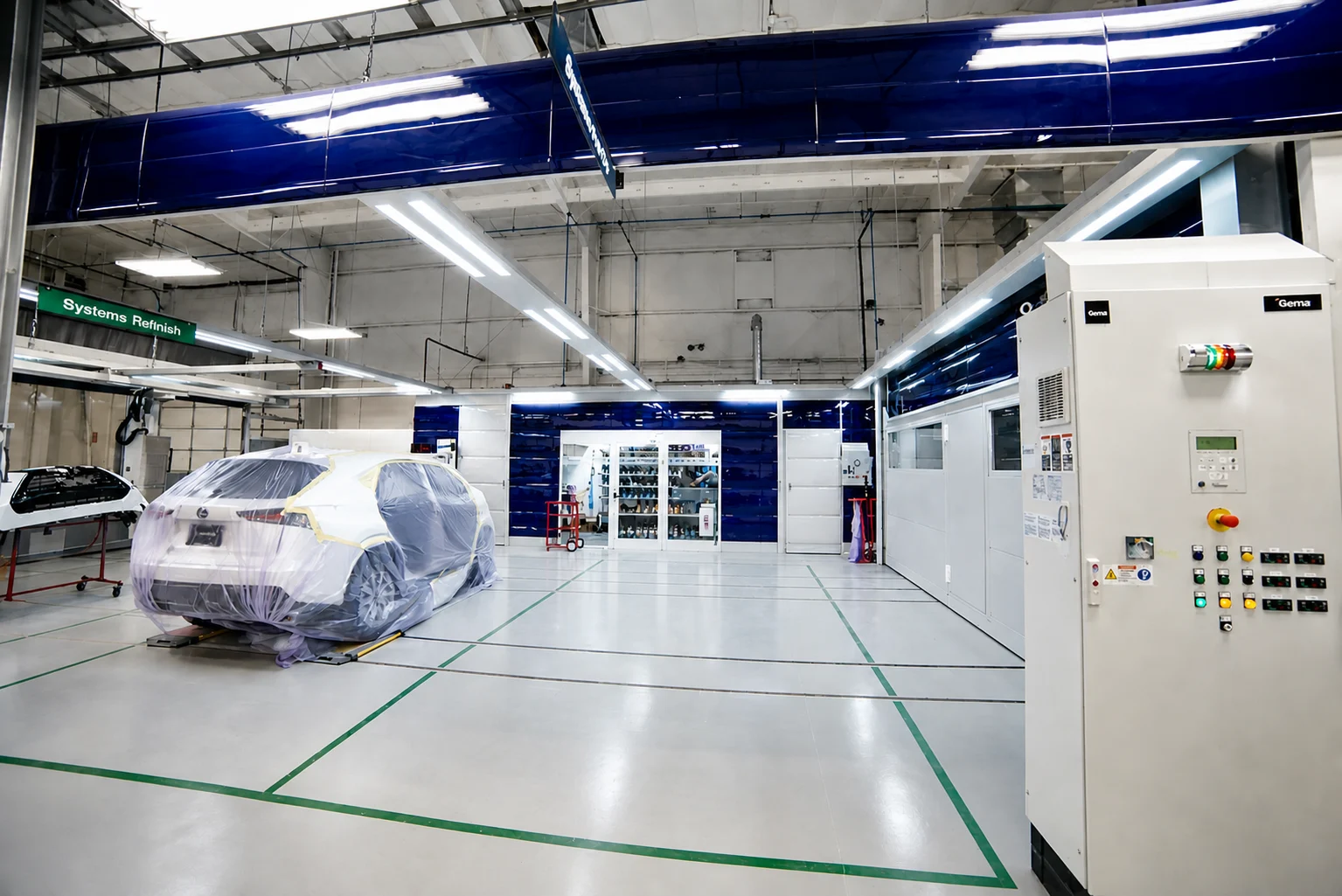 Masked vehicle in refinishing prep area at DCR Systems Mentor collision repair facility